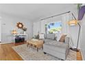 Bright living room featuring a comfortable sectional sofa and natural light at 715 Braidwood Ln, Orlando, FL 32803