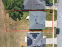 Aerial view of a property with a fenced backyard and a gray roof at 1225 Greenley Ave, Groveland, FL 34736