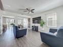 Cozy living room with modern furnishings, stylish decor, and hardwood floors at 1225 Greenley Ave, Groveland, FL 34736