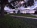 Beautiful home featuring a lush green lawn, manicured landscaping, and modern architectural design at 1581 Forest Ave, Winter Park, FL 32789