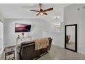 Modern living room featuring tile floors, neutral walls, and a large wall-mounted TV at 1397 Candlewyck Dr, Orlando, FL 32807