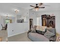 Open-concept living space with tile flooring, fan and neutral wall paint for versatile decorating at 1397 Candlewyck Dr, Orlando, FL 32807