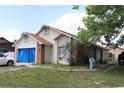 One-story home with a well-kept lawn, showcasing a blend of light siding and brick accents for a welcoming feel at 14057 Ithaca Way, Orlando, FL 32826
