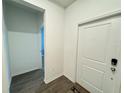 Neutral entryway featuring hard surface floors and an interior door at 1412 Brentwood Dr, Kissimmee, FL 34746
