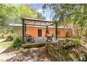 Backyard deck featuring outdoor seating and a covered pergola at 1860 Ne 62Nd St, Ocala, FL 34479