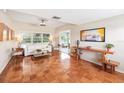 Inviting living room with parquet floors, neutral walls, large windows, and stylish decor at 2707 Chelsea St, Orlando, FL 32803