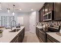 Stylish kitchen with a spacious island, stainless steel appliances, and sleek cabinetry at 3529 Yarian Dr, Haines City, FL 33844