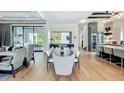 Open concept Living Room includes hardwood floors, large dining table, and direct access to the patio at 532 Worthington Dr, Winter Park, FL 32789