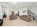 Bright living room with tile flooring and an open-concept design at 5826 Wooden Pine Dr, Orlando, FL 32829
