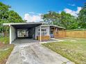 Inviting home with covered parking and a charming front porch, ideal for relaxation at 844 Rosalia Dr, Sanford, FL 32771