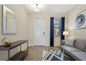 Inviting entryway with tile floors, console table, and modern decor at 8549 Zoeller Hills Dr, Davenport, FL 33896