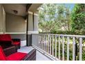 Comfortable outdoor seating on the front porch, ideal for enjoying the lush greenery and fresh air at 14722 Porter Rd, Winter Garden, FL 34787