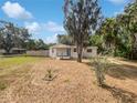 Charming single-story home featuring a well-maintained lawn and inviting blue door at 2845 Ellis Ave, Lakeland, FL 33803