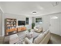 Cozy living room featuring neutral tones, ample seating, and stylish décor at 2845 Ellis Ave, Lakeland, FL 33803