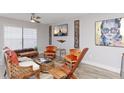 Inviting living room with natural light, unique furnishings, and decorative accents for a cozy atmosphere at 3254 Oak Lake Pl # 137, Winter Park, FL 32792