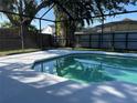 Inviting screened-in pool offers a relaxing oasis in a private backyard at 377 Blue Bayou Dr, Kissimmee, FL 34743
