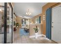 Bright living room with vaulted ceiling, tile flooring, and plenty of natural light at 600 Fallsmead Cir, Longwood, FL 32750
