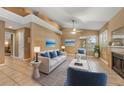 Cozy living area featuring a fireplace, neutral paint, and vaulted ceilings at 600 Fallsmead Cir, Longwood, FL 32750