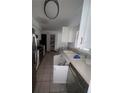 View of a kitchen with essential appliances and ample cabinet space, ready for a personal touch at 808 Woodling Pl, Altamonte Springs, FL 32701