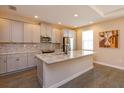 Modern kitchen with granite counters, stainless steel appliances, and a mosaic backsplash at 810 Greybull Run, Lake Mary, FL 32746