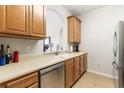 Bright kitchen with light colored cabinets, countertops, and tiled floor at 8296 Portofino Dr # 405, Davenport, FL 33896