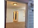 View into living room with neutral paint, plush carpet, and modern ceiling light at 11574 Westwood Blvd # 1126, Orlando, FL 32821