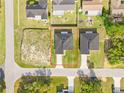 Aerial view showcasing the property's layout, including the house, yard, and surrounding neighborhood at 14953 Sw 38Th Cir, Ocala, FL 34473