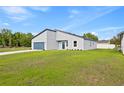 Lovely exterior view of a single-Gathering home with well-kept lawn on a sunny day at 14953 Sw 38Th Cir, Ocala, FL 34473