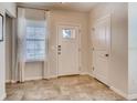 Bright foyer with natural light, tile flooring, white front door with glass insert, and a convenient coat closet at 1550 Dalehurst Ln, Kissimmee, FL 34744