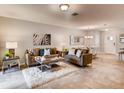 Cozy living area showcasing tile flooring, comfortable seating, and stylish decor at 1554 Dalehurst Ln, Kissimmee, FL 34744