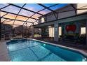 Beautiful private screened-in pool with spa and covered lanai with outdoor seating, perfect for entertaining at 1970 Summer Dr, Davenport, FL 33897