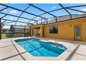 Inviting screened-in pool area with a covered lanai, perfect for outdoor relaxation at 2142 Victoria Dr, Davenport, FL 33837