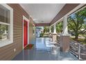 Spacious front porch offers a relaxing outdoor space and classic architectural details at 216 S Holly Ave, Sanford, FL 32771