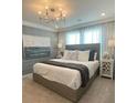 Comfortable main bedroom with soft lighting, stylish accents, and neutral tones at 6450 Horseshoe Lane Way, St Cloud, FL 34773