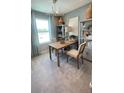 Bright office space with a wooden desk, stylish decor, and ample natural light at 6450 Horseshoe Lane Way, St Cloud, FL 34773