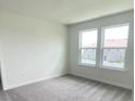 Bright, airy bedroom with two large windows offering plenty of natural light at 6458 Horseshoe Lane Way, St Cloud, FL 34773