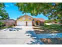 Charming two-story home features a brick-accented facade and a spacious two-car garage at 6630 Abeydon Ct, Orlando, FL 32818