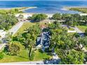 Aerial view of the home and surroundings with a beach nearby at 910 Cypress Ave, St Cloud, FL 34769
