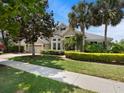 Attractive home with a well-kept lawn, palm trees, and a two-car garage, offering a welcoming exterior at 922 Home Grove Dr, Winter Garden, FL 34787
