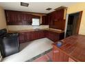 View of kitchen features a double sink, plenty of cabinet space, and a black range at 11625 Churchill St, Orlando, FL 32817