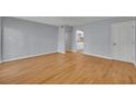 Bright living room with hardwood floors, neutral walls, and an open doorway, creating a cozy atmosphere at 151 N Orlando Ave # 115, Winter Park, FL 32789