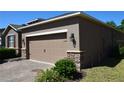 Close up of garage door and front of home at 245 Brunswick Dr, Davenport, FL 33837