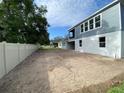 A spacious backyard bordered by a pristine white fence, ready for landscaping and outdoor living at 2531 Blue Wave Pl, Oviedo, FL 32765