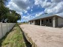 Spacious backyard view with a block-wall home, featuring framed window openings and a blank-slate lot at 2644 Ravencliffe Ter, Oviedo, FL 32765