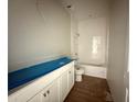 Bright bathroom featuring white cabinets, tile floors, and a walk-in shower at 2644 Ravencliffe Ter, Oviedo, FL 32765