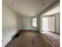Open-concept living room featuring hardwood floors, natural light, and modern fixtures at 2644 Ravencliffe Ter, Oviedo, FL 32765