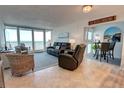 Cozy living room with ocean views, comfortable seating, and coastal decor at 5203 S Atlantic Ave # 416B, New Smyrna Beach, FL 32169