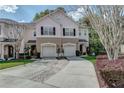 Inviting townhouse with brick-paved driveway, a garage, and a vibrant, well-maintained lawn at 558 Pinebranch Cir, Winter Springs, FL 32708