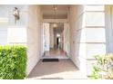 Inviting entryway with decorative lighting and spacious foyer and wood flooring at 7264 Hawksnest Blvd, Orlando, FL 32835