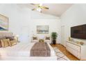Spacious main bedroom boasts high ceilings, a ceiling fan, and ample natural light at 7264 Hawksnest Blvd, Orlando, FL 32835